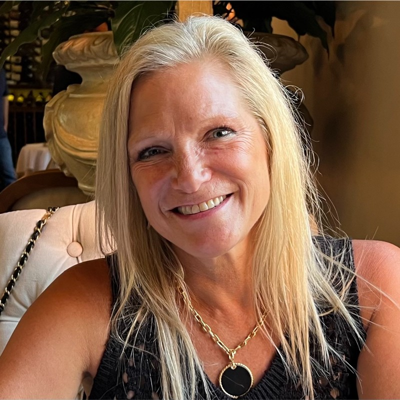 Rae Shanahan is the Chief Strategy Officer for Businessolver seen posing for a photo with a bright smile on her face